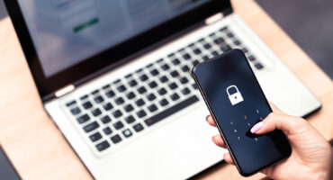 Phone with multi-factor authentication reflecting the essential 8 cyber security principles.
