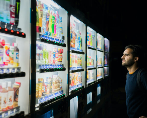 Image of person viewing different supermarket brands.