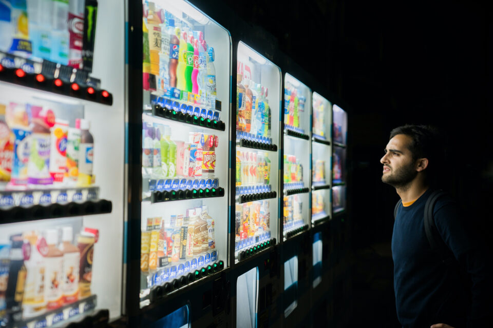 Image of person viewing different supermarket brands.