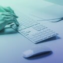 Photo of hands typing at a keyboard used as the feature image for an article titled 'Websites, word counts, and SEO—how many words do you actually need to rank well?'.